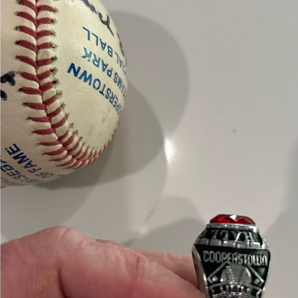 Silver and Red Championship Ring and baseball